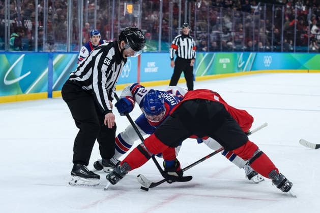 Contested ball between USA and Canada during the Olympic Winter games, Winterspiele,Spiele, Summer games Milano-Cortina 2026, Men s Ice hockey, Eishockey Final - Canada vs USA on February 22, 2026 at Milano Santagiulia Ice Hockey Arena in Milan, Italy  Copyright: xFabrizioxCarabelli IPAxSportx xipa-agency.netx xx IPA_71870057 IPA_Agency_IPA71870057