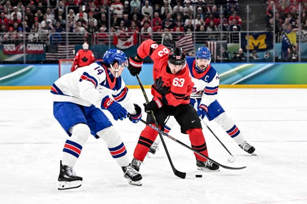 MILAN, ITALY - FEBRUARY 22: Brad Marchand of Canada in action against Brock Faber of United States L) and Auston Matthews of United States R) during the Ice hockey, Eishockey Men™s Gold Medal Game match between Canada and USA on day sixteen of the Milano Cortina 2026 Winter Olympic Games, Olympische Spiele, Olympia, OS at Milano Santagiulia Ice Hockey Arena on February 22, 2026 in Milan, Italy. Milan Milano Santagiulia Ice Hockey Arena Italy *** MILAN, ITALY FEBRUARY 22 Brad Marchand of Canada in action against Brock Faber of United States L and Auston Matthews of United States R during the Ice Hockey Men™s Gold Medal Game match between Canada and USA on day sixteen of the Milano Cortina 2026 Winter Olympic games at Milano Santagiulia Ice Hockey Arena on February 22, 2026 in Milan, Italy Milan Milano Santagiulia Ice Hockey Arena Italy Copyright: xJustPictures.ch AndreaxBrancax jp-en-EuSpIm-AB-AAB_054222022026
