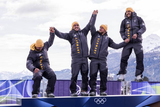 CORTINA, ITALY - FEBRUARY 22: Gold medalists Johannes Lochner Thorsten Margis Jorn Wenzel Georg Fleischhauer (Germany) jumping on the podium during the Bobsleigh 4-man medal ceremony at the Milano Cortina 2026 Olympics at Cortina Sliding Centre on day 16 of the Milano Cortina 2026 Olympics on February 22, 2026 in Cortina, Italy. Editorial use only. Italy Copyright: xSteffiexWunderlx