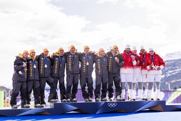 CORTINA, ITALY - FEBRUARY 22: The podium - Silver Francesco Friedrich Matthias Sommer Alexander Schueller Felix Straub (Germany), Gold Johannes Lochner Thorsten Margis Jorn Wenzel Georg Fleischhauer (Germany) and Bronze Michael Vogt Andreas Haas Amadou David Ndiaye Mario Aeberhard (Switzerland) poses together during the Bobsleigh 4-man medal ceremony at the Milano Cortina 2026 Olympics at Cortina Sliding Centre on day 16 of the Milano Cortina 2026 Olympics on February 22, 2026 in Cortina, Italy. Editorial use only. Italy Copyright: xSteffiexWunderlx