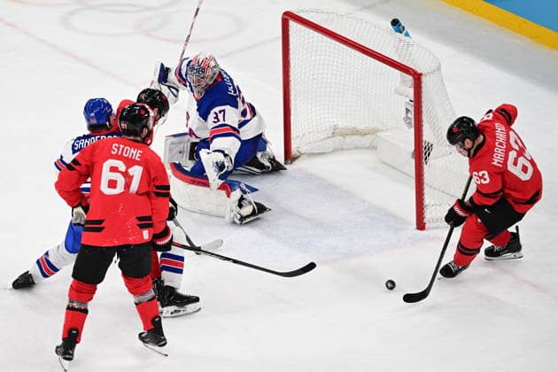 XXV Winter Olympic Games, Olympische Spiele, Olympia, OS in Milan, Italy, on February 22, 2026. Men s Ice hockey, Eishockey final, Canada vs USA. From right: Brad Marchand (CAN), goalkeeper Connor Hellebuyck (USA) and Mark Stone (CAN). (CTKxPhoto MichalxKamaryt) CTKPhotoP2026022204223  CTKPhotoP2026022204223