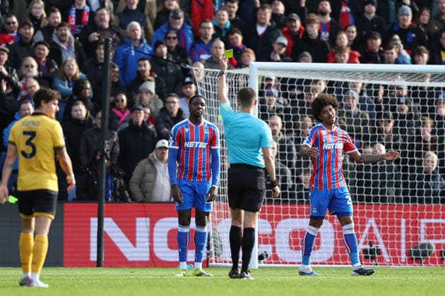 22nd February 2026; Selhurst Park, Selhurst, London, England; Premier League Football, Crystal Palace versus Wolverhampton Wanderers; Jaydee Canvot of Crystal Palace receives a yellow card from referee Thomas Kirk  KatiexChan Content restricted for UK based newspaper