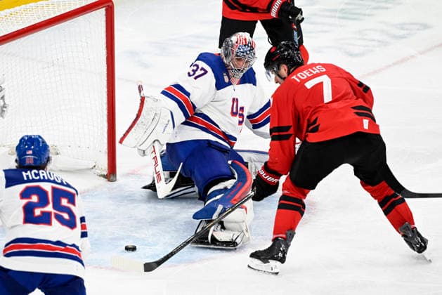 LKS 20260222 Devon Toews of Canada has almost an empty goal in front of him but goalkeeper Connor Hellebuyck of USA blocks the shot with his stick during the men s Ice hockey, Eishockey gold medal match between Canada and USA during the Milano Cortina Winter Olympics at the Milano Santagiulia Ice Hockey Arena in Milan on February 22, 2026. - EMMI KORHONEN Milano Italy BO2nY1vDcTk  Copyright: xEmmixKorhonenx BO2nY1vDcTk