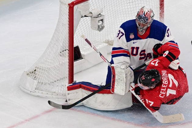 XXV Winter Olympic Games, Olympische Spiele, Olympia, OS in Milan, Italy, on February 22, 2026. Men s Ice hockey, Eishockey final, Canada vs USA. From left: goalkeeper Connor Hellebuyck (USA) and Macklin Celebrini (CAN). (CTKxPhoto MichalxKamaryt) CTKPhotoP2026022204717  CTKPhotoP2026022204717