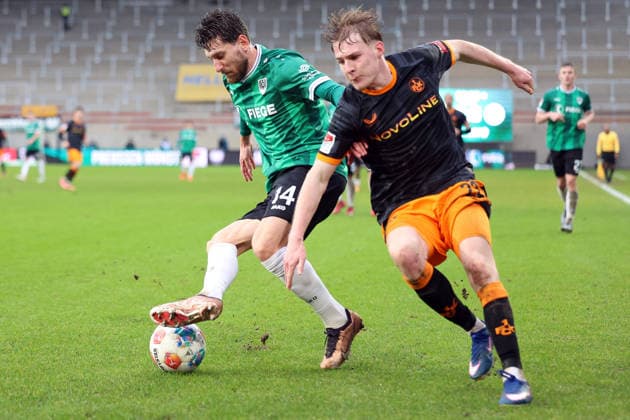 22 02 2026, xrekx, Fußball 2 Bundesliga, Preußen Münster 1 FC Kaiserslautern v l Charalambos Makridis Preussen Muenster Mika Haas 1 FC Kaiserslautern Zweikampf, Aktion, action, battle for the ball DFL DFB REGULATIONS PROHIBIT ANY USE OF PHOTOGRAPHS as IMAGE SEQUENCES and or QUASI VIDEO Münster