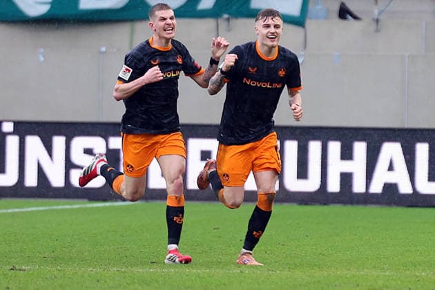 22 02 2026, xrekx, Fußball 2 Bundesliga, Preußen Münster 1 FC Kaiserslautern v l Torjubel nach dem Tor zum celebrating the goal celebrate 1 3 durch Norman Bassette 1 FC Kaiserslautern mit Paul Joly 1 FC Kaiserslautern DFL DFB REGULATIONS PROHIBIT ANY USE OF PHOTOGRAPHS as IMAGE SEQUENCES and or QUASI VIDEO Münster