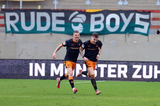 22 02 2026, xrekx, Fußball 2 Bundesliga, Preußen Münster 1 FC Kaiserslautern v l Torjubel nach dem Tor zum celebrating the goal celebrate 1 3 durch Norman Bassette 1 FC Kaiserslautern mit Paul Joly 1 FC Kaiserslautern DFL DFB REGULATIONS PROHIBIT ANY USE OF PHOTOGRAPHS as IMAGE SEQUENCES and or QUASI VIDEO Münster