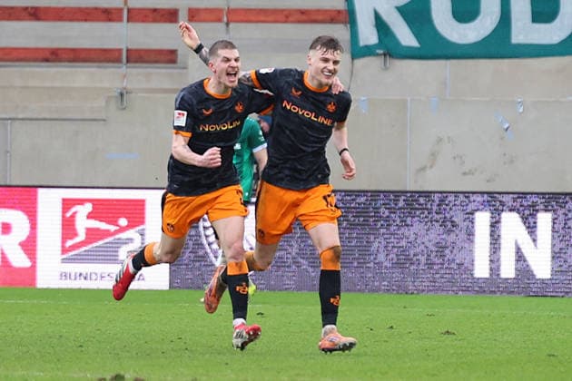 22 02 2026, xrekx, Fußball 2 Bundesliga, Preußen Münster 1 FC Kaiserslautern v l Torjubel nach dem Tor zum celebrating the goal celebrate 1 3 durch Norman Bassette 1 FC Kaiserslautern mit Paul Joly 1 FC Kaiserslautern DFL DFB REGULATIONS PROHIBIT ANY USE OF PHOTOGRAPHS as IMAGE SEQUENCES and or QUASI VIDEO Münster