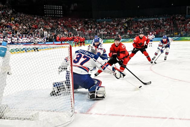 MILAN, ITALY - FEBRUARY 22: Macklin Celebrini of Canada tries to score against goalkeeper Connor Hellebuyck of United States during the Ice hockey, Eishockey Men™s Gold Medal Game match between Canada and USA on day sixteen of the Milano Cortina 2026 Winter Olympic Games, Olympische Spiele, Olympia, OS at Milano Santagiulia Ice Hockey Arena on February 22, 2026 in Milan, Italy. Milan Milano Santagiulia Ice Hockey Arena Italy *** MILAN, ITALY FEBRUARY 22 Macklin Celebrini of Canada tries to score against goalkeeper Connor Hellebuyck of United States during the Ice Hockey Men™s Gold Medal Game match between Canada and USA on day sixteen of the Milano Cortina 2026 Winter Olympic games at Milano Santagiulia Ice Hockey Arena on February 22, 2026 in Milan, Italy Milan Milano Santagiulia Ice Hockey Arena Italy Copyright: xJustPictures.ch AndreaxBrancax jp-en-EuSpIm-AB-DSC_546522022026