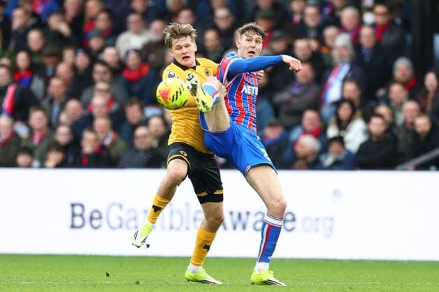 Jorgen Strand Larsen of Crystal Palace under pressure from David Moller Wolfe of Wolverhampton Wanderers Crystal Palace v Wolverhampton Wanderers, Premier League, Football, Selhurst Park, London, UK - 22 Feb 2026London Selhurst Park United Kingdom EDITORIAL USE ONLY No use with unauthorised audio, video, data, fixture lists, club league logos or live services. Online in-match use limited to 120 images, no video emulation. No use in betting, games or single club league player publications.  Copyright: xSimonxDael Shutterstockx 16681548ax