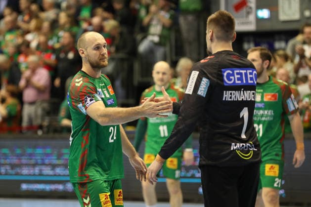 22 02 2026, xgox, Handball Daikin HBL SC Magdeburg GWD Minden emspor, v l Christian O Sullivan Magdeburg, 24 , Sergey Hernandez Ferrer Magdeburg, 1 Celebrating the victory, cheering after the end of the game Magdeburg