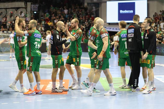 22 02 2026, xgox, Handball Daikin HBL SC Magdeburg GWD Minden emspor, v l Magdeburg celebrating the victory, cheering after the end of the game Magdeburg