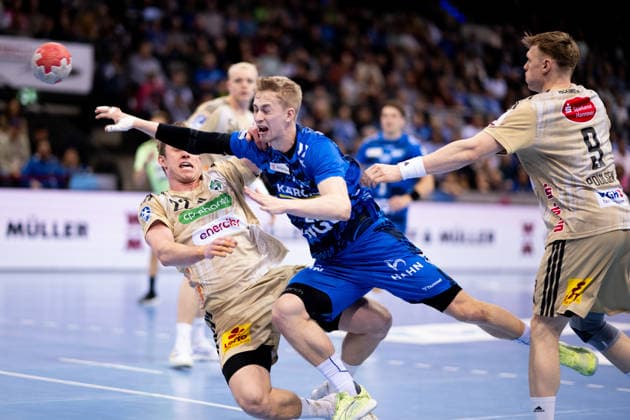 Marian Michalczik, TSV Hannover Burgdorf, 22 , againstTorben Matzken, TVB Stuttgart, 22 , TVB Stuttgart vs TSV Hannover Burgdorf, DAIKIN Handballbundesliga, 22 Matchday, Season 2025 2026, 22 02 2026 Eibner Pressefoto Andreas Ulmer TVB Stuttgart vs TSV Hannover Burgdorf, DAIKIN Handballbundesliga, 22 Matchday, Season 2025 2026, 22 02 2026 Stuttgart Copyright: xEibner-Pressefoto AndreasxUlmerx EP_AUR