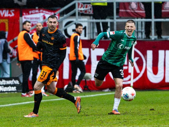 Luca Sirch 1 FC Kaiserslautern, 31 in duel against Tobias Raschl SC Preussen Muenster, 32 Preussen Muenster vs 1 FC Kaiserslautern, Soccer, 2 Bundesliga, Matchday 23, Season 2025 2026, 22 02 2026 DFL REGULATES PROHIBIT ANY USE OF PHOTOGRAPHS AS IMAGE SEQUENCES AND OR QUASI VIDEO, Preussen Muenster vs 1 FC Kaiserslautern, Football, 2 Bundesliga, Matchday 23, Season 2025 2026, 22 02 2026 Muenster Copyright: xEibner-Pressefoto DamianxKruczynx EP_DKI