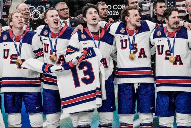 Team USA members hold the honorary jersery of late player Johnny Gaudreau during the National Anthem after winning the Men s Hockey Gold Medal game between the USA and Canada at the Milano Santagiulia Ice hockey, Eishockey Arena in Milan, Italy, on Sunday, February 22, 2026. USA defeated Silver Medalists Canada in overtime 2-1. Slovakia won the Bronze Medal.  OLY20260222330 RICHARDxELLIS