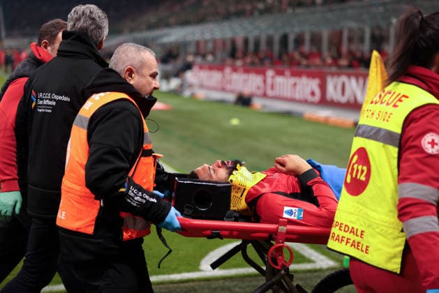 Milan, Italy, 22nd February 2026. Ruben Loftus-Cheek of AC Milan is taken away on a stretcher after clashing with Edoardo Corvi of Parma Calcio the AC Milan vs Parma Serie A match at Giuseppe Meazza, Milan. Picture credit should read: Jonathan Moscrop Sportimage EDITORIAL USE ONLY. No use with unauthorised audio, video, data, fixture lists, club league logos or live services. Online in-match use limited to 120 images, no video emulation. No use in betting, games or single club league player publications. SPI_016_MILAN_PARMA SPI-4549-0016