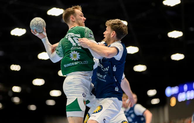 from l Mathias GIDSEL B , Lukas Becher BHC , duel, action, Handball 1 Bundesliga, 22 Matchday, Bergischer HC BHC Füchse Berlin B , on 22 02 2026 in Düsseldorf Germany Mitsubishi Electric Halle