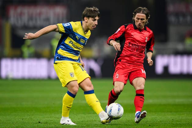 AC Milan v Parma Calcio - Serie A Adrian Bernabe of Parma Calcio competes for the ball with Luka Modric of AC Milan during the Serie A football match between AC Milan and Parma Calcio. Milan Italy Copyright: xNicolòxCampox