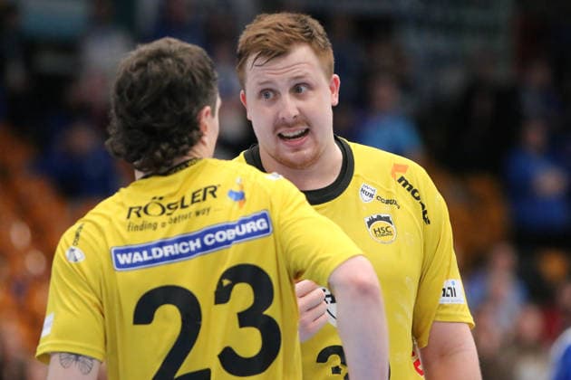 22 02 2026 Handball Men 2025 2026 2 Handball Bundesliga 20 Matchday Dessau Roßlauer HV 06 HSC 2000 Coburg Anhalt Arena Dessau Nils Röller Coburg, 30, yellow and Jannes Krone Coburg, 23, yellow talk to each other Dessau Roßlau Saxony Anhalt Germany