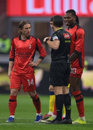 Milan, Italy, 22nd February 2026. Luka Modric of AC Milan and Enrico Delprato of Parma Calcio look on as Rafael Leao of AC Milan reacts with the Referee Marco Piccinini after being shown a yellow card during the AC Milan vs Parma Serie A match at Giuseppe Meazza, Milan. Picture credit should read: Jonathan Moscrop Sportimage EDITORIAL USE ONLY. No use with unauthorised audio, video, data, fixture lists, club league logos or live services. Online in-match use limited to 120 images, no video emulation. No use in betting, games or single club league player publications. SPI_047_MILAN_PARMA SPI-4549-0047