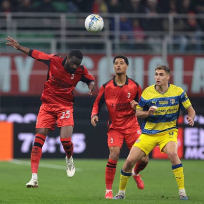Milan, Italy, 22nd February 2026. Koni De Winter of AC Milan and Mateo Pellegrino of Parma Calcio look on as Fikayo Tomori of AC Milan heads the ball away during the AC Milan vs Parma Serie A match at Giuseppe Meazza, Milan. Picture credit should read: Jonathan Moscrop Sportimage EDITORIAL USE ONLY. No use with unauthorised audio, video, data, fixture lists, club league logos or live services. Online in-match use limited to 120 images, no video emulation. No use in betting, games or single club league player publications. SPI_098_MILAN_PARMA SPI-4549-0098