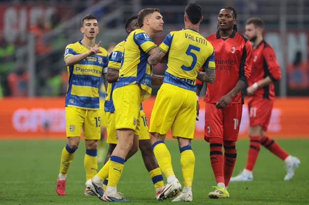 Milan, Italy, 22nd February 2026. Rafael Leao of AC Milan steps in as Lautaro Valenti of Parma Calcio is restrained by staff and team mates as he reacts as the Referee Marco Piccinini makes a VAR check for a possible foul by Mariano Troilo of Parma Calcio as he scored to give the visitors a 1-0 lead during the AC Milan vs Parma Serie A match at Giuseppe Meazza, Milan. Picture credit should read: Jonathan Moscrop Sportimage EDITORIAL USE ONLY. No use with unauthorised audio, video, data, fixture lists, club league logos or live services. Online in-match use limited to 120 images, no video emulation. No use in betting, games or single club league player publications. SPI_108_MILAN_PARMA SPI-4549-0108