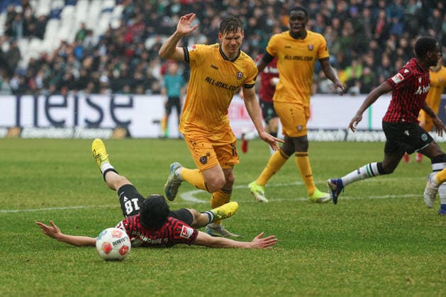 2 Bundesliga Hannover 96 Dynamo Dresden on 22 02 2026 at Heinz von Heiden Arena in Hannover Daisuke Yokota Hannover lies on the pitch after a tackle with player Alexander Rossipal Dresden 19 MH