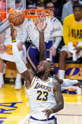 February 22, 2026, Los Angeles, California, United States: Los Angeles Lakers™ LeBron James (23) goes to the basket under pressure from Boston Celtics™ Neemias Queta (88) during an NBA, Basketball Herren, USA basketball game at Crypto.com Arena on Sunday, Feb. 22, 2026 in Los Angeles. Los Angeles United States - ZUMAs197 20260222_aaa_s197_306 Copyright: xRingoxChiux