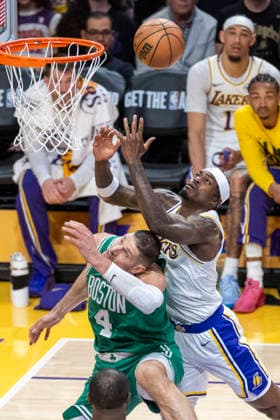 February 22, 2026, Los Angeles, California, United States: Los Angeles Lakers™ Jarred Vanderbilt (2) vies for the ball against Boston Celtics™ Nikola Vucevic (4) during an NBA, Basketball Herren, USA basketball game at Crypto.com Arena on Sunday, Feb. 22, 2026 in Los Angeles. Los Angeles United States - ZUMAs197 20260222_aaa_s197_308 Copyright: xRingoxChiux