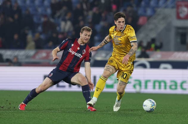 Udinese™s Nicolo Zaniolo fight for the ball with Bologna™s Tommaso Pobega during the Serie A soccer match between Bologna and Udinese at the Renato Dall™Ara Stadium in Bologna -Monday, February 23, 2026. - Soccer .  Copyright: xGiannixSantandrea LaPressex