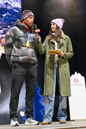 OLYMPICS - Winter Olympic Games, Olympische Spiele, Olympia, OS Milano Cortina 2026 INNSBRUCK,AUSTRIA,23.FEB.26 - OLYMPICS - Winter Olympic Games Milano Cortina 2026, Olympic Team Austria, medal celebration. Image shows Benjamin Karl (AUT) and Karina Toth (ORF).  GEPAxpictures xDanielxSchoenherr