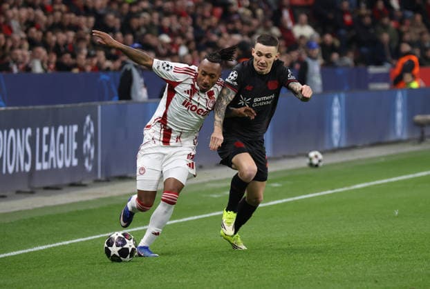 v l Gelson Martins Olympiakos Piraeus 10 , Alejandro Grimaldo Bayer Leverkusen, 20 GER, Bayer 04 Leverkusen vs Olympiakos Piraeus, Football, Champions League, Play offs, Second leg, Season 2025 2026, 24 02 2026 GER, Bayer 04 Leverkusen vs Olympiakos Piraeus, Football, Champions League, Play offs, Second leg, Season 2025 2026, 24 02 2026 Leverkusen Copyright: xEibner-Pressefotox xThomasxStoecx EP_TSR