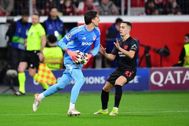 Bayer 04 Leverkusen v Olympiacos - UEFA Champions League LEVERKUSEN, GERMANY - FEBRUARY 24: Lucas Vazquez (21) of Bayer 04 Leverkusen in action against Konstantinos Colakis (88) of Olympiacos during the UEFA Champions League play-off match between Bayer 04 Leverkusen and Olympiacos at BayArena in Leverkusen, Germany, on February 24, 2026. Hesham Elsherif Anadolu Leverkusen Germany. Editorial use only. Please get in touch for any other usage.  Copyright: x2026xAnadoluxHeshamxElsherifx