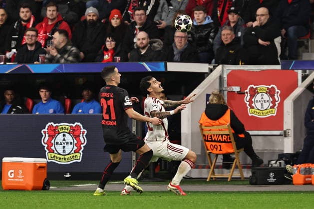 GER, Champions League, Bayer Leverkusen vs Olympiakos Piraeus 24 02 2026, BayArena, Leverkusen, GER, Champions League, Bayer Leverkusen vs Olympiakos Piraeus in picture Chiquinho Olympiakos Piraeus, 22, white shields the ball from Lucas Vazquez Bayer 04 Leverkusen, 21, black nordphotoxGmbHx xSJS nph00070