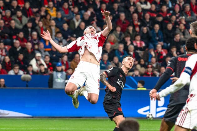 UEFA Champions League 2025 2026 Bayer 04 Leverkusen vs Olympiakos Piraeus, Play Offs second leg, Tuesday, 23 02 2026 BayArena Nordrhein Westfalen, Germany Alejandro Grimaldo 20 Lorenzo Pirola Olympiakos Piraeus, 5 Copyright: xCelinaxLeiersx