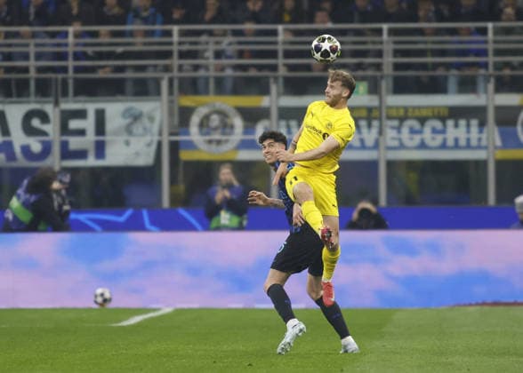 CALCIO - UEFA Champions League - Inter - FC Internazionale vs FK Bodo Glimt Ole Didrik Blomberg of FK Bodo Glimt and Alessandro Bastoni of FC Inter during the Uefa Champions League, second leg play-off, season 2025 2026, football match between, FC Internazionale Milano v Fotballklubben Bodo Glimt on 24 February 2026 at â?? Giuseppe Meazza Stadium, San Siro, Milan, Italy Photo Nderim Kaceli Milan Italy  Copyright: xIPAxSport ABACAx