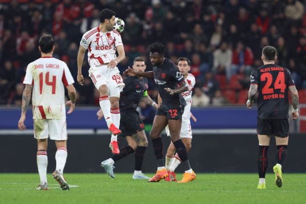 Mehdi Taremi Olympiacos FC and Edmond Tapsoba Bayer 04 Leverkusen battle for the ball during the UEFA Champions League 2025 26 League Knockout Play off Second Leg match between Bayer 04 Leverkusen and Olympiacos FC at BayArena on February 24, 2026 in Leverkusen, Germany Photo by Oliver Kaelke DeFodi Images