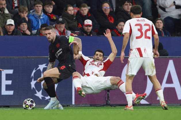 Robert Andrich Bayer 04 Leverkusen and Mehdi Taremi Olympiacos FC battle for the ball during the UEFA Champions League 2025 26 League Knockout Play off Second Leg match between Bayer 04 Leverkusen and Olympiacos FC at BayArena on February 24, 2026 in Leverkusen, Germany Photo by Oliver Kaelke DeFodi Images