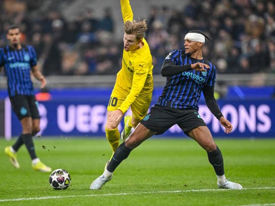 Jens Petter Hauge FK Bodo Glimt and Manuel Akanji FC Internazionale Milano battle for the ball during the UEFA Champions League 2025 26 League Knockout Play off Second Leg match between FC Internazionale Milano and FK Bodo Glimt at Stadio San Siro on February 24, 2026 in Milan, Italy Photo by Harry Langer DeFodi Images