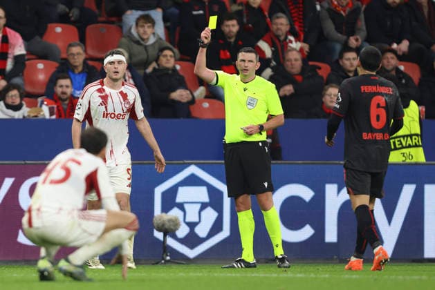 Lorenzo Pirola Olympiacos FC gets the yellow card during the UEFA Champions League 2025 26 League Knockout Play off Second Leg match between Bayer 04 Leverkusen and Olympiacos FC at BayArena on February 24, 2026 in Leverkusen, Germany Photo by Oliver Kaelke DeFodi Images