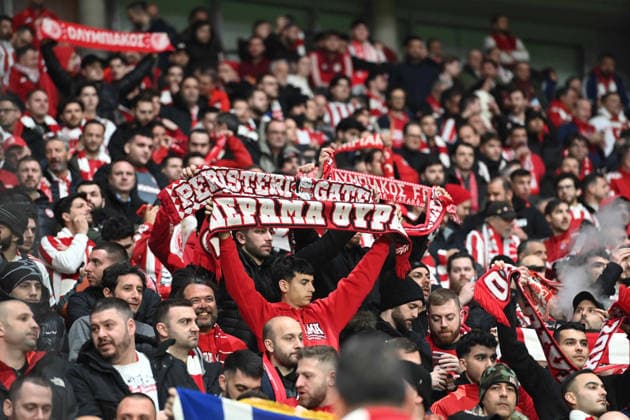 Fans of Olympiakos Piraeus Piraeus Feature, symbol photo, border motif, Football Champions League, Play Offs, Bayer 04 Leverkusen LEV Olympiakos Piraeus PI 0 0 on 24 02 2026 in Leverkusen Germany UEFA regulations prohibit any use of photographs as image sequences and or quasi video Â