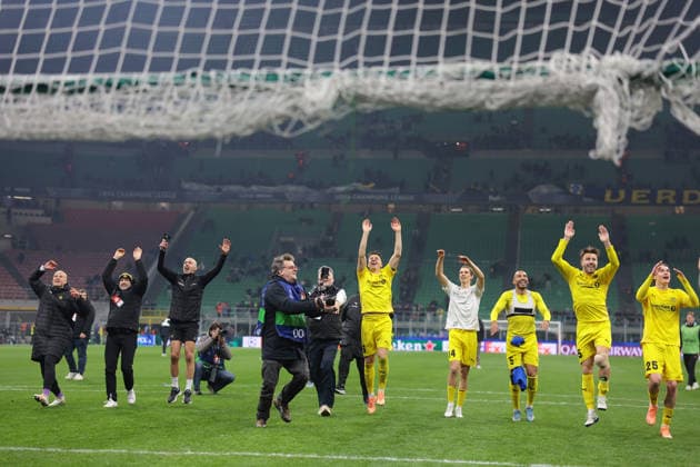 Milan, Italy, 24th February 2026. FK Bodo Glimt players and staff celebrate the 2-1 victory on the night and 5-2 aggregate score following the Internazionale vs FK Bodo Glimt UEFA Champions League Play Off 2nd Leg match at Giuseppe Meazza, Milan. Picture credit should read: Jonathan Moscrop Sportimage EDITORIAL USE ONLY. No use with unauthorised audio, video, data, fixture lists, club league logos or live services. Online in-match use limited to 120 images, no video emulation. No use in betting, games or single club league player publications. SPI_020_INTER_BODOGLIMT_UCL_ SPI-4550-0020