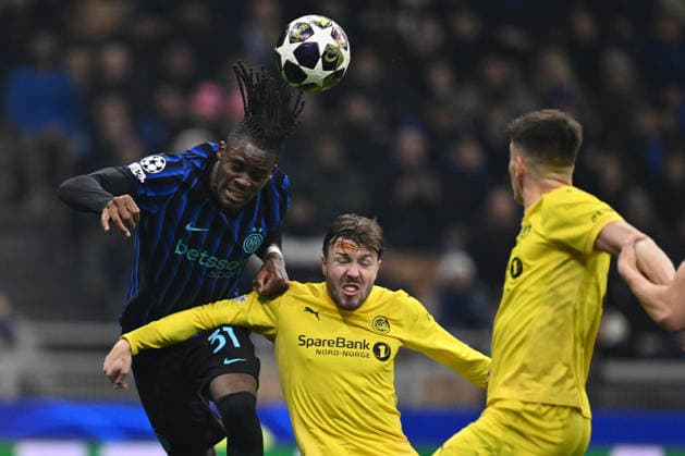 CALCIO - UEFA Champions League - Inter - FC Internazionale vs FK Bodo Glimt Yann Aurel Bisseck of F.C. Inter and Fredrik Andre Bjorkan of FK Bodo Glimt are in action during the UEFA Champions League 2025 26 League Knockout Play-off Second Leg match between F.C. Inter and FK Bodo Glimt at the San Siro Stadium on February 24, 2026 in Milan, Italy. Milan Italy  Copyright: xIPAxSport ABACAx