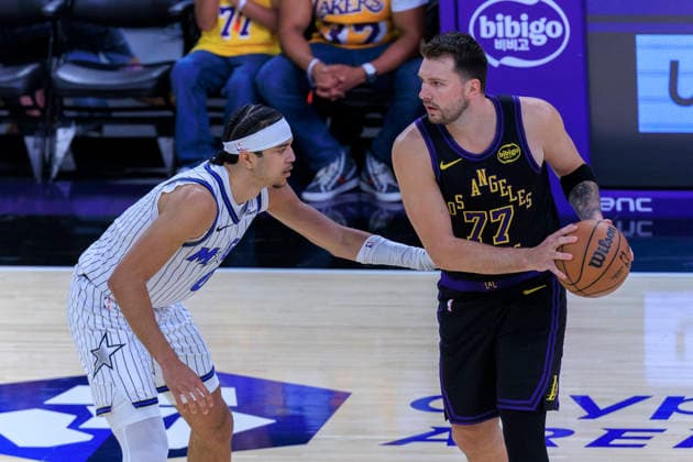February 24, 2026, Los Angeles, California, USA: Luka Doncic 77 of the Los Angeles Lakers receives the ball as Anthony Black 0 of the Orlando Magic guards during their regular season NBA, Basketball Herren, USA game on Tuesday February 24, 2026 at Crypto.com Arena in Los Angeles, California. ARIANA RUIZ PI Los Angeles USA - ZUMAp124 20260224_zaa_p124_014 Copyright: xArianaxRuizx
