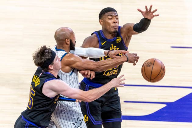 February 24, 2026, Los Angeles, California, USA: Orlando MagicÃ¢â‚¬â ¢s Jevon Carter (2) vie for the ball against Los Angeles LakersÃ¢â‚¬â ¢ Austin Reaves (15) and Rui Hachimura (28) during an NBA, Basketball Herren, USA basketball game at Crypto.com Arena on Tuesday, Feb. 24, 2026 in Los Angeles. NBA 2026: Magic 110:109 Lakers  - ZUMAc68_ 20260224_zaf_c68_052 Copyright: xRingoxChiux