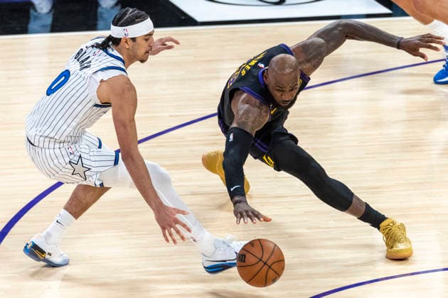 February 24, 2026, Los Angeles, California, USA: Los Angeles LakersÃ¢â‚¬â ¢ LeBron James (23) and Orlando MagicÃ¢â‚¬â ¢s Anthony Black (0) vie for the ball during an NBA, Basketball Herren, USA basketball game at Crypto.com Arena on Tuesday, Feb. 24, 2026 in Los Angeles. NBA 2026: Magic 110:109 Lakers  - ZUMAc68_ 20260224_zaf_c68_058 Copyright: xRingoxChiux