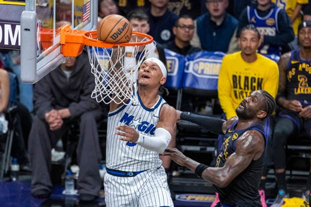 February 24, 2026, Los Angeles, California, United States: Orlando Magic™s Paolo Banchero (5) dunks against Los Angeles Lakers™ Deandre Ayton (5) during an NBA, Basketball Herren, USA basketball game at Crypto.com Arena in Los Angeles. NBA 2026: Magic 110:109 Lakers. NBA 2026: Magic Vs Lakers In Los Angeles, US - 24 Feb 2026  - ZUMAs197 20260224_aaa_s197_324 Copyright: xRingoxChiux