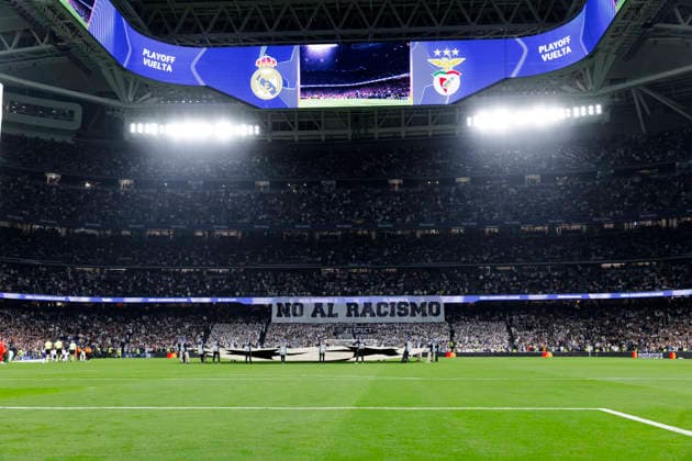 UEFA champions league - Real Madrid vs Benfica MADRID, SPAIN - February 25:Real Madrid supporters display a giant banner that reads no to racism during the UEFA champions league 2025 26 Knockout Play-off second Leg match between Real Madrid and Benfica at Santiago Bernabeu Stadium. (Photo by Guille Martinez f22photo) Madrid Santiago Bernabeu Stadium Spain Copyright: xGuillermoxMartinezx