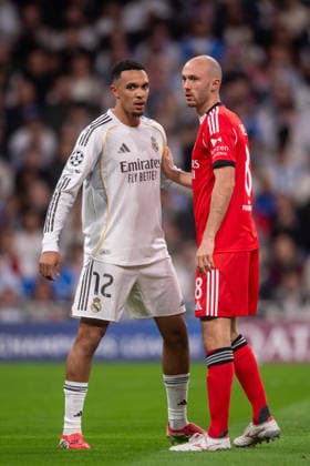 February 25, 2026, Madrid, Guimaraes, Spain: Trent Alexander Arnold of Real Madrid CF is seen with Fredrik Aursnes of SL Benfica during the UEFA Champions League 2025 26 League Knockout Play-off Second Leg match between Real Madrid C.F. and SL Benfica at Estadio Santiago Bernabeu on February 25, 2026 in Madrid, Spain. Madrid Spain - ZUMAl192 20260225_zsp_l192_019 Copyright: xMiguelxLemosx