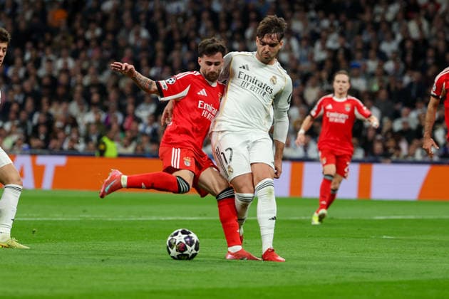 Madrid, Spain February 25, 2026 FBL UEFA Champions League 2025 26 Real Madrid SL Benfica Rafa S L Benfica , Raul Asencio Real Madrid battles for the Ball during the UEFA Champions League 2025 26 knockout play offs match between Real Madrid and SL Benfica at the Santiago BernabÃ u Stadium on February 25, 2026 in Madrid, Spain Copyright: JoaquimxFerreira